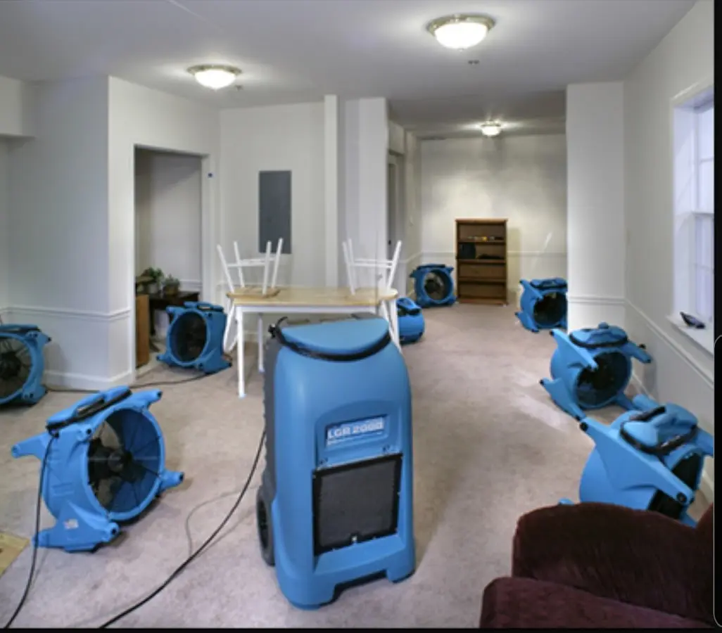 Air movers and dehumidifier setup for Water Damage Restoration in Gilmer